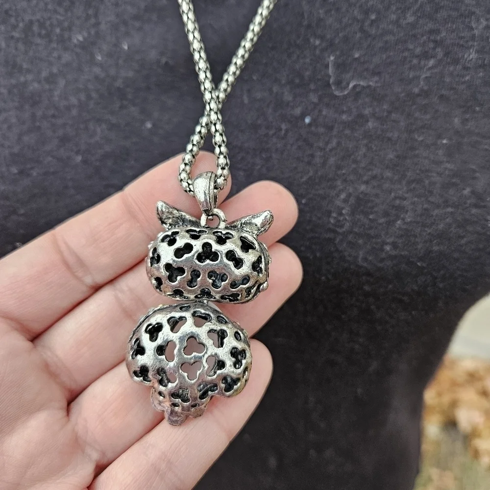 long silver tone chain necklace with articulated owl pendant